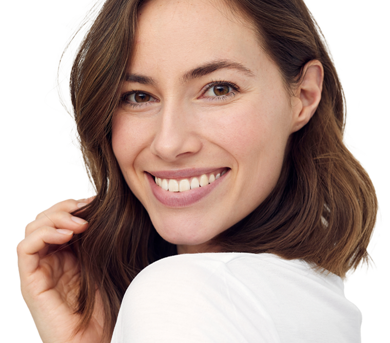 portrait of beautiful naturally brunette woman smiling and looking in camera with white teeth